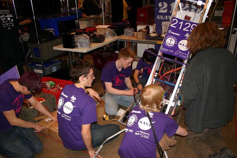 IMG_2649.JPG - Putting on the new front wheels, new treads, new sprockets, new axles and new chain.