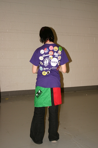 IMG_2804.JPG - Most teams were giving away buttons. Stephanie got most of them. Here is her back.